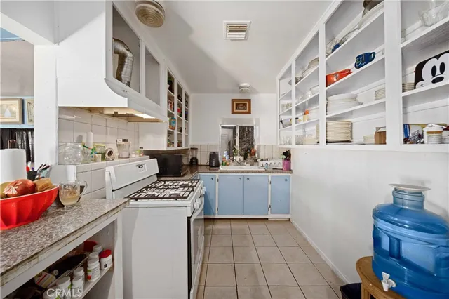 a kitchen with stainless steel appliances a sink and a stove