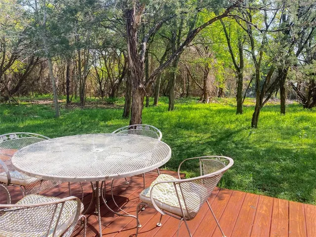 a table and chairs in a garden