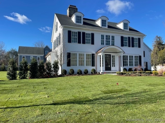 36 Maple Avenue South Westport, CT 06880 - Photo 2 of 18 a front view of a house with a yard