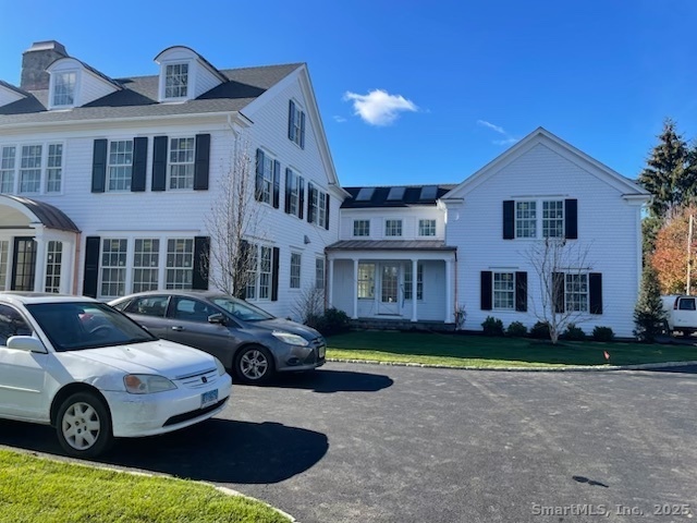 36 Maple Avenue South Westport, CT 06880 - Photo 6 of 18 a front view of residential houses with yard and parking space