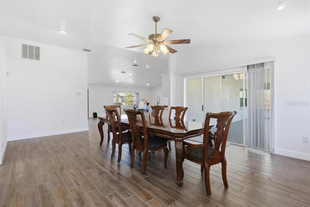 30 Patuxent Lane Palm Coast, FL 32164 - Photo 11 of 34 a view of a a dining room with furniture window and wooden floor