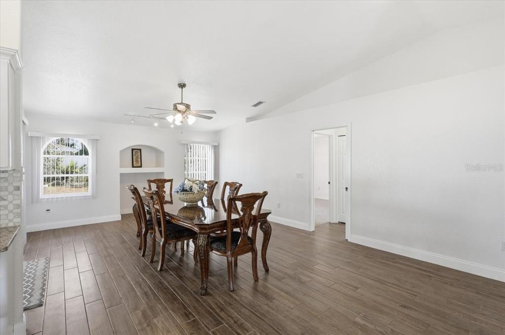 30 Patuxent Lane Palm Coast, FL 32164 - Photo 12 of 34 a view of a dining room with furniture and wooden floor