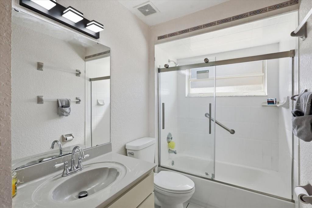 30 Patuxent Lane Palm Coast, FL 32164 - Photo 18 of 34 a bathroom with a sink toilet and shower