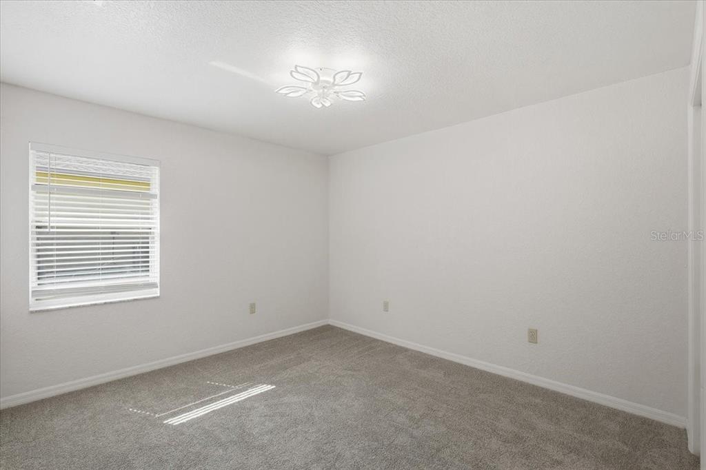30 Patuxent Lane Palm Coast, FL 32164 - Photo 20 of 34 an empty room with a empty space and window