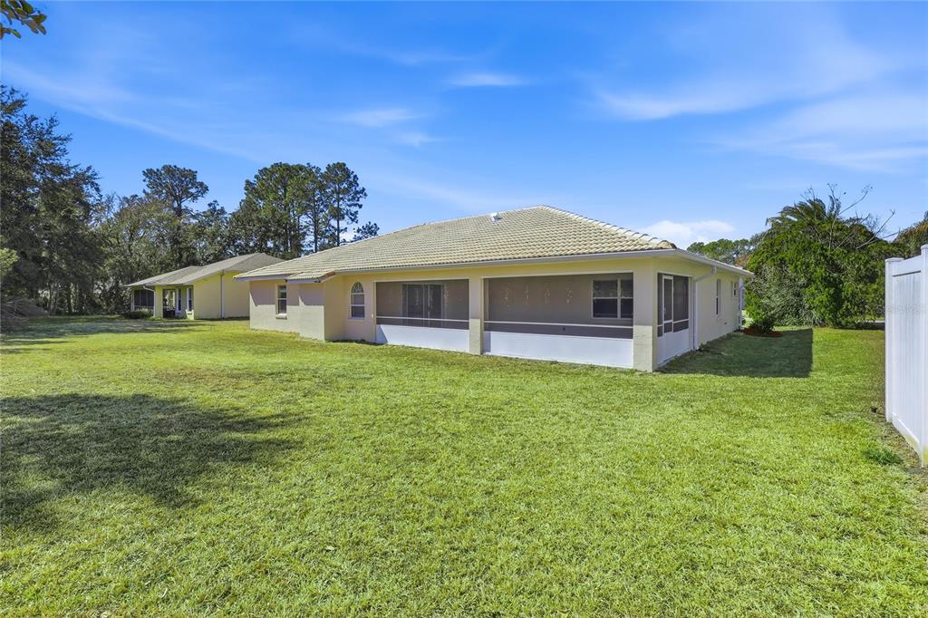30 Patuxent Lane Palm Coast, FL 32164 - Photo 23 of 34 a view of a house with a backyard
