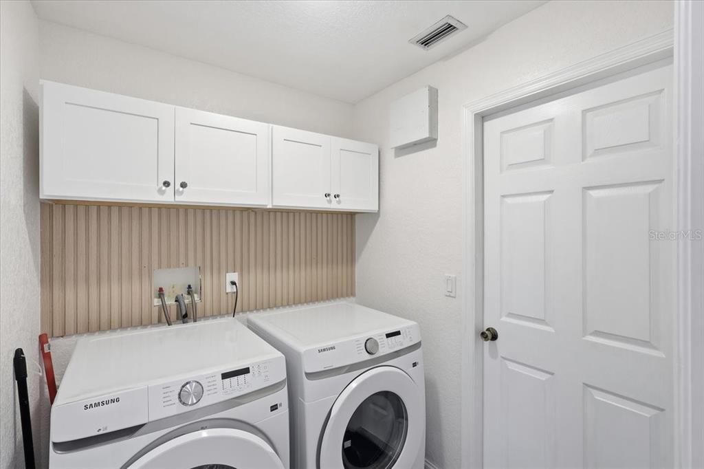 30 Patuxent Lane Palm Coast, FL 32164 - Photo 26 of 34 a utility room with dryer and washer