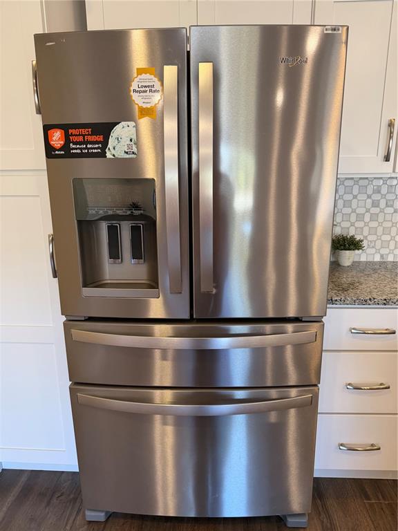 30 Patuxent Lane Palm Coast, FL 32164 - Photo 4 of 34 a metallic refrigerator freezer sitting inside of a kitchen
