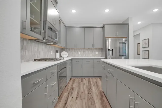 a kitchen with cabinets and sink