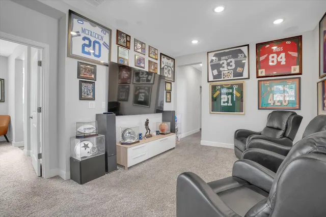 a living room with furniture and painting on the wall
