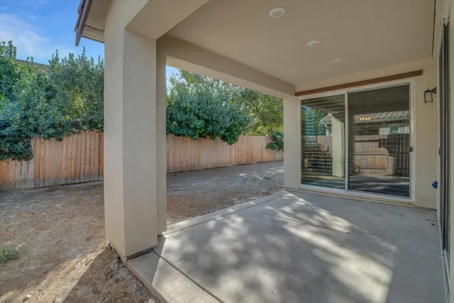 a view of a room with wooden floor and outdoor space