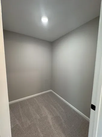 an empty room with a bench