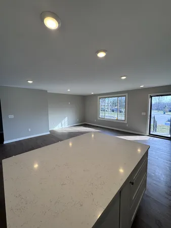 a view of an empty room with windows