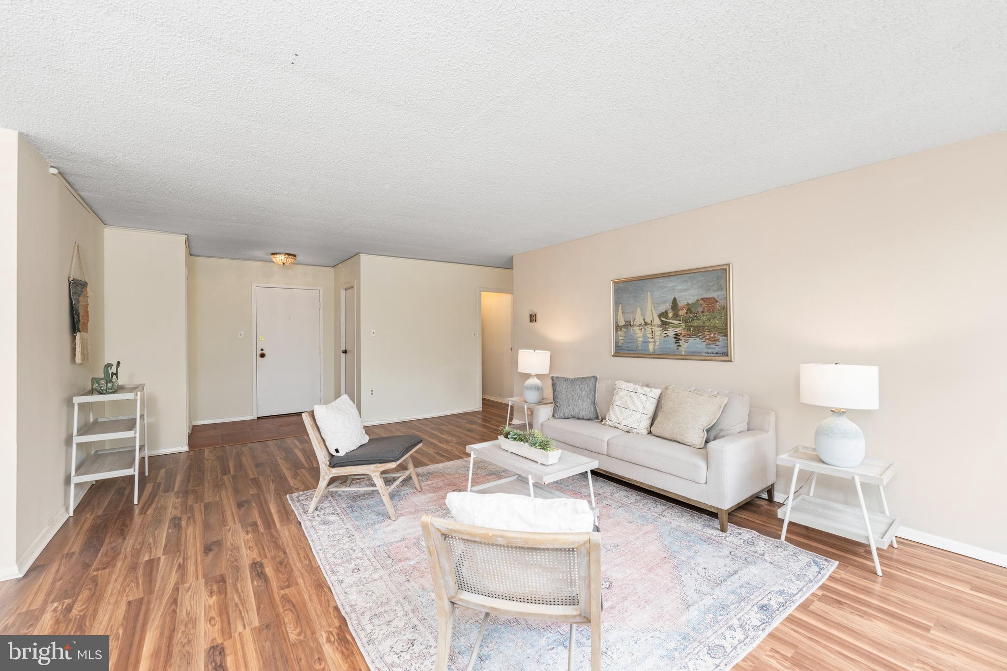 4401 Roland Avenue, Unit 115 Baltimore, MD 21210 - Photo 17 of 54 a living room with furniture and a wooden floor