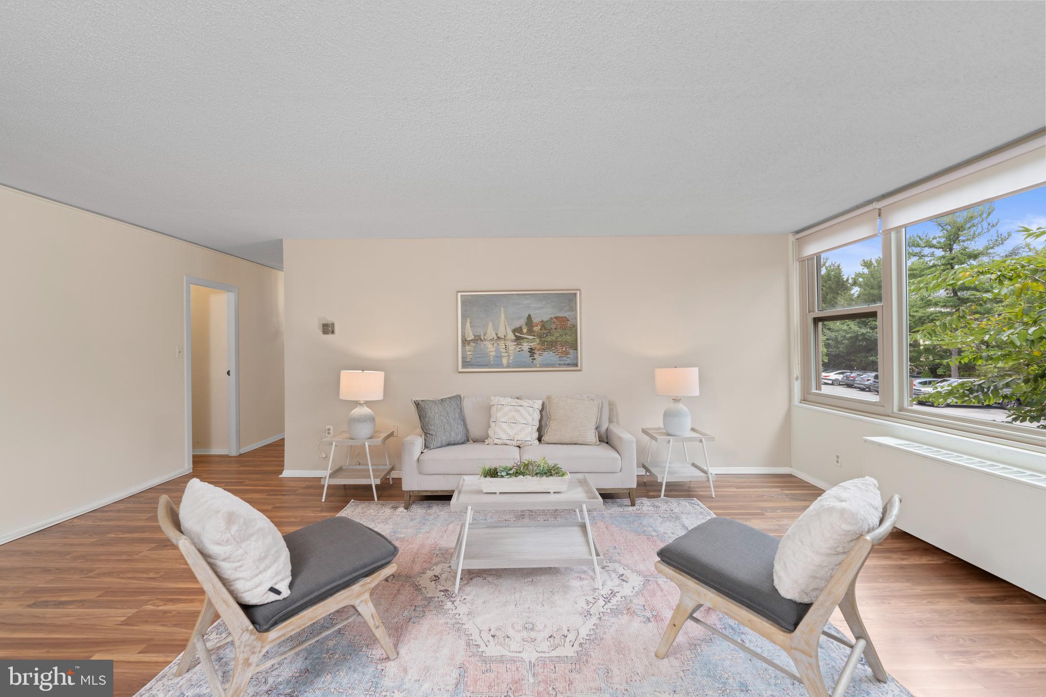 4401 Roland Avenue, Unit 115 Baltimore, MD 21210 - Photo 18 of 54 a living room with furniture and a large window