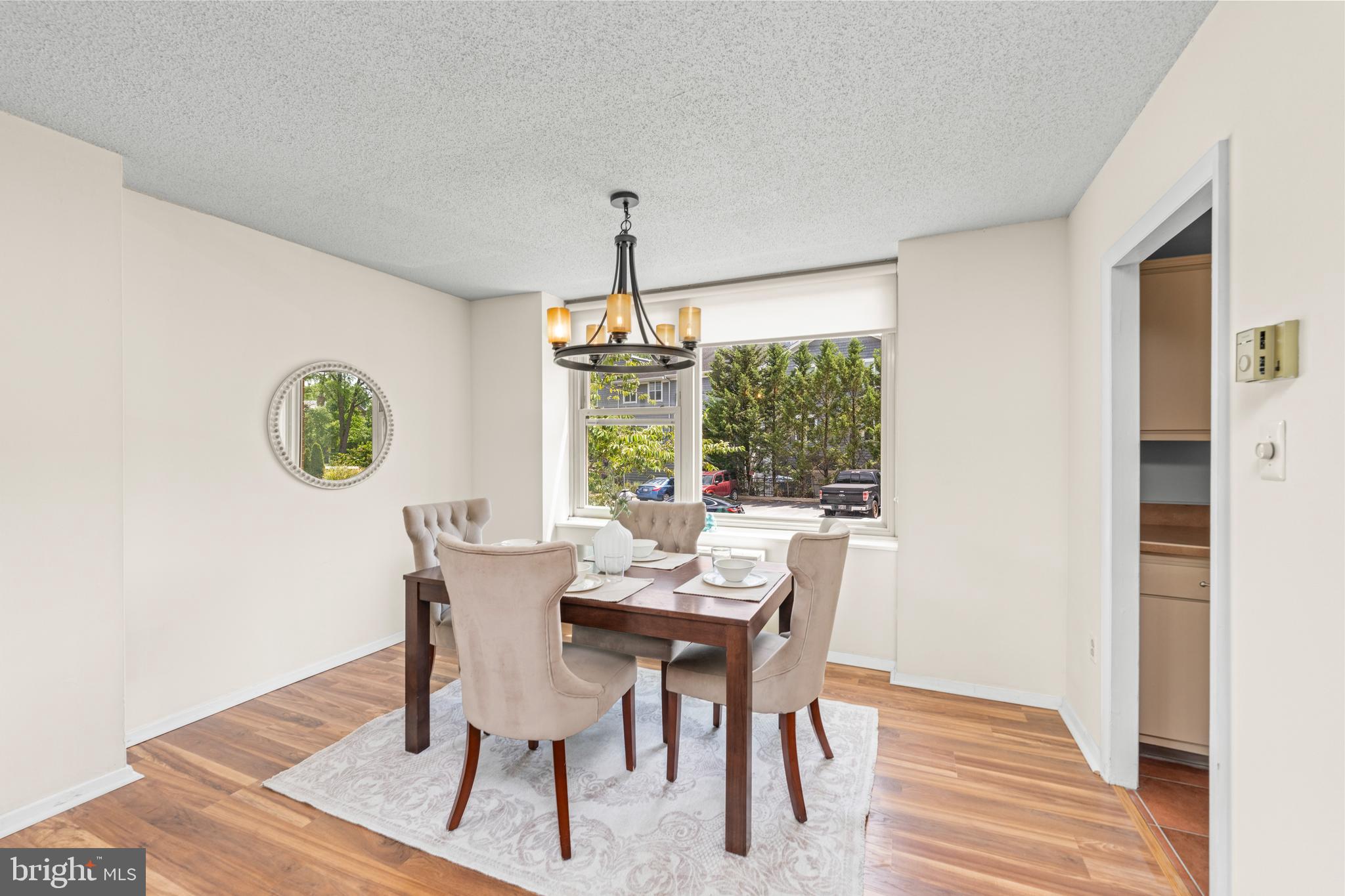 4401 Roland Avenue, Unit 115 Baltimore, MD 21210 - Photo 21 of 54 a view of a dining room with furniture window and outside view