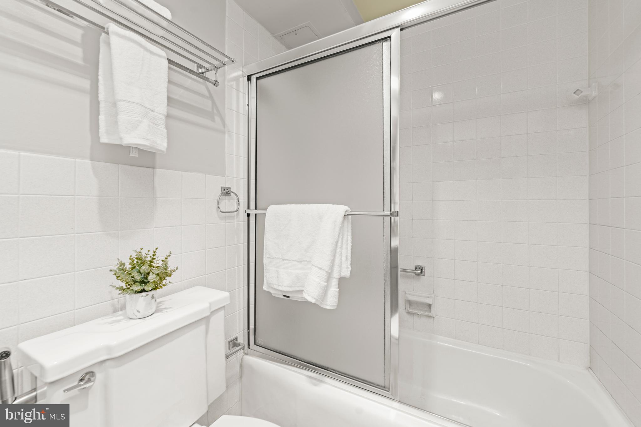 4401 Roland Avenue, Unit 115 Baltimore, MD 21210 - Photo 41 of 54 a bathroom with a shower and a sink