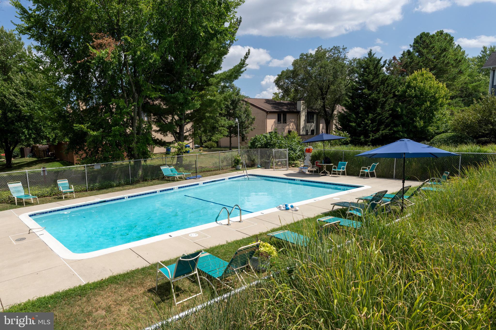 4401 Roland Avenue, Unit 115 Baltimore, MD 21210 - Photo 48 of 54 a view of a backyard with swimming pool and furniture