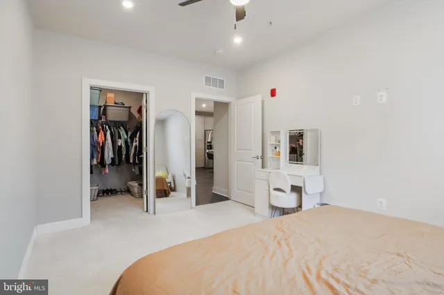 a bedroom with a bed and gym equipment