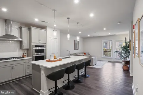 a kitchen with a table and chairs in it