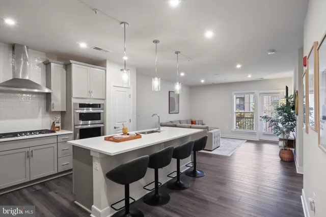 a kitchen with a table and chairs in it