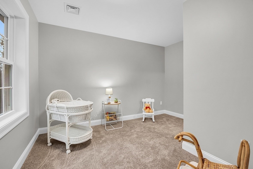 236 Davis Road, Unit APPLEWOOD Westminster, MA 01473 - Photo 36 of 42 a view of a room with furniture and a window