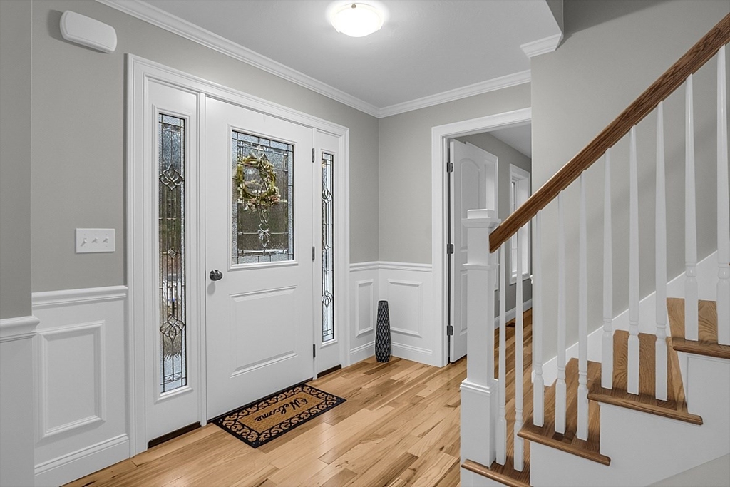 236 Davis Road, Unit APPLEWOOD Westminster, MA 01473 - Photo 8 of 42 a bedroom with a bed and wooden floor