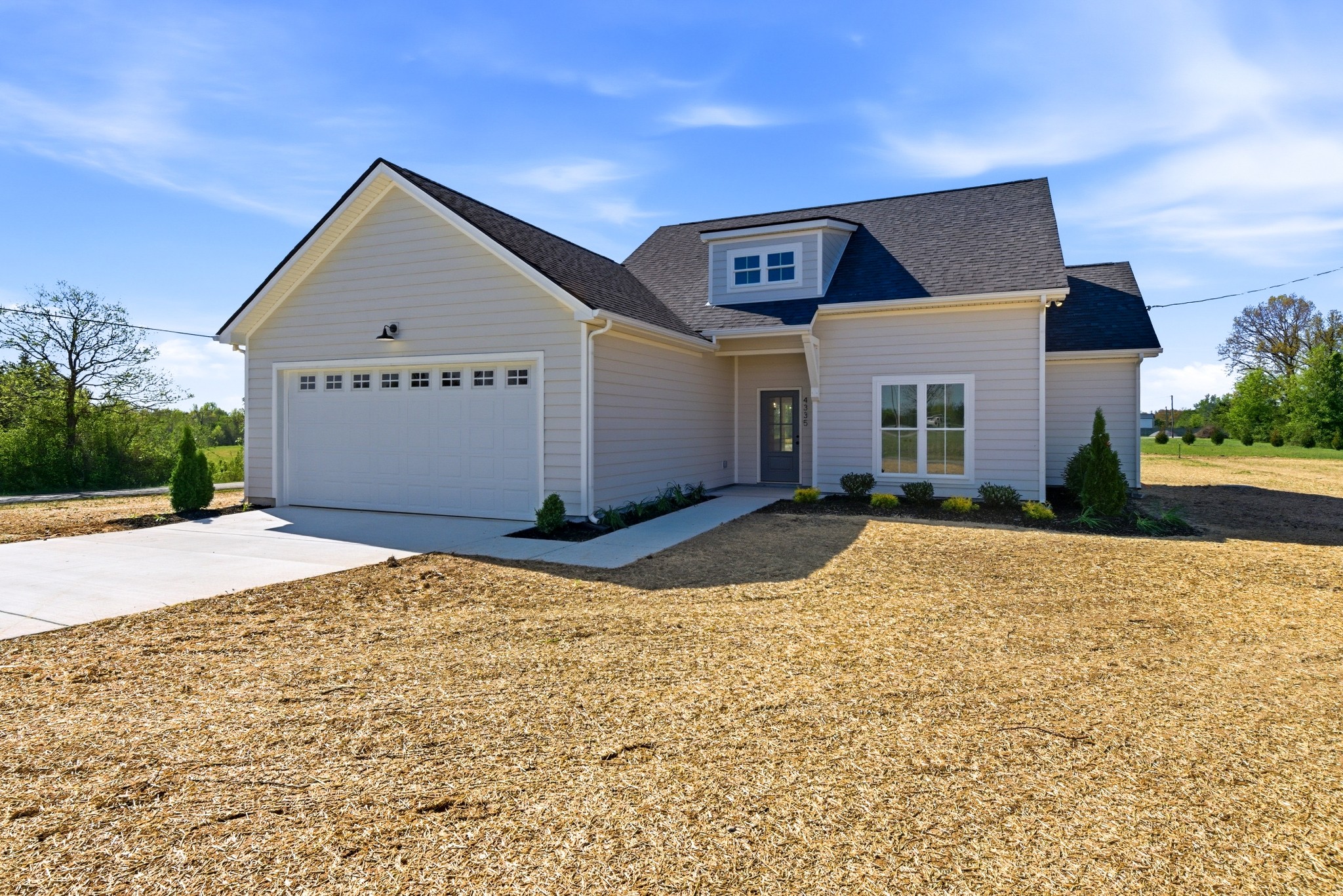 a front view of a house with a yard