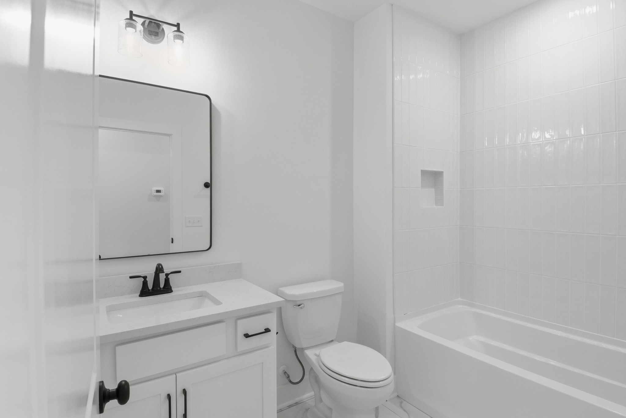 4335 Bybee Branch Road McMinnville, TN 37110 - Photo 19 of 25 a bathroom with a sink a toilet and a bathtub