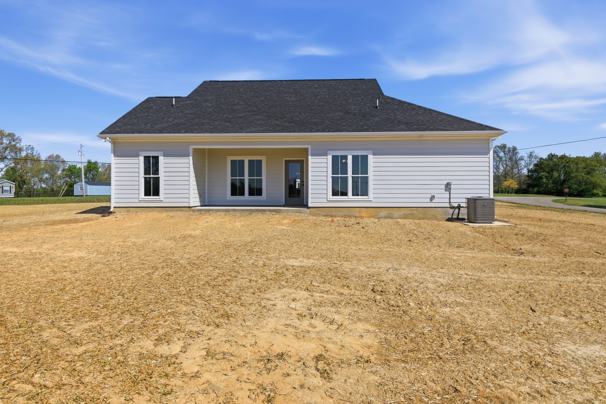 4335 Bybee Branch Road McMinnville, TN 37110 - Photo 23 of 25 a front view of house with yard and trees in the background