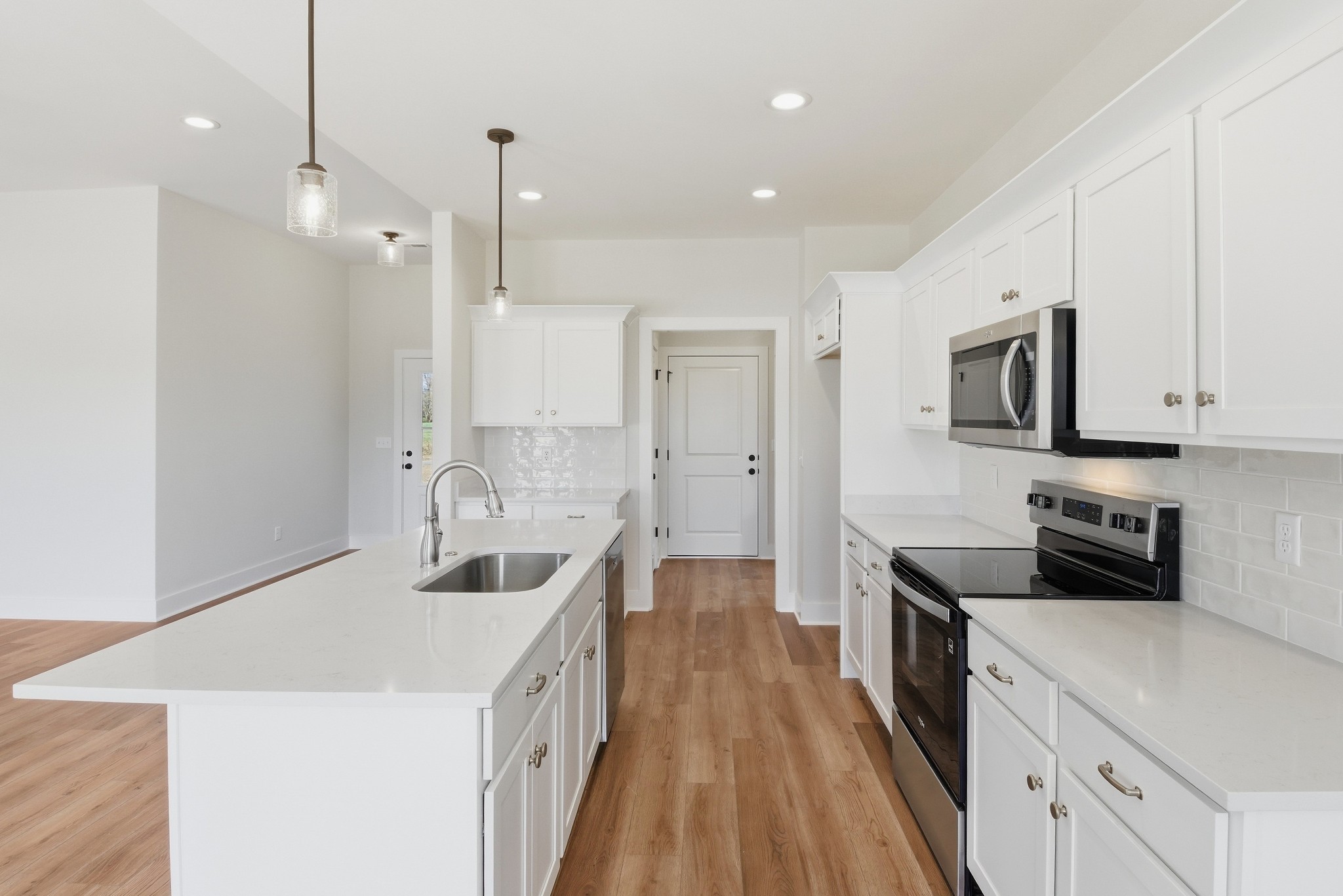 4335 Bybee Branch Road McMinnville, TN 37110 - Photo 9 of 25 a kitchen with a sink a counter top space stainless steel appliances and cabinets