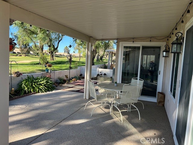 1085 Pauma Valley Road Banning, CA 92220 - Photo 15 of 18 a view of a patio with chairs and tables