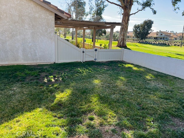 1085 Pauma Valley Road Banning, CA 92220 - Photo 18 of 18 a view of an swimming pool with seating area and garden