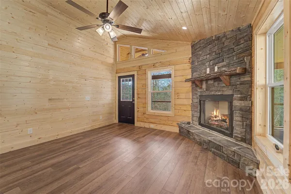 a view of a room with wooden floor