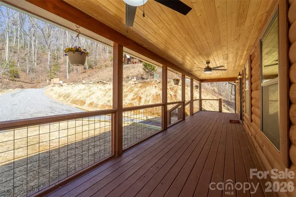 a view of a room with wooden floor and balcony