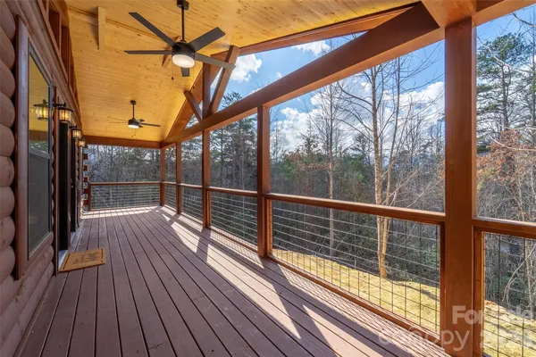 a view of balcony with wooden floor