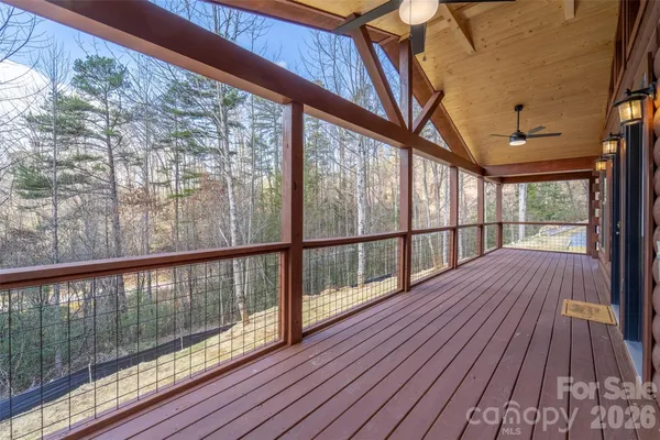 a view of balcony with small yard