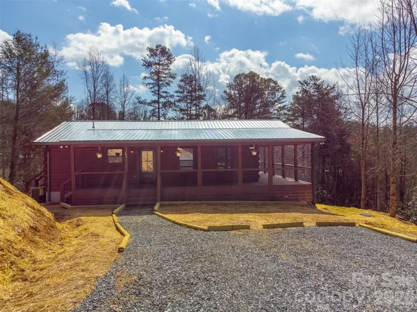 a view of a swimming pool with a yard
