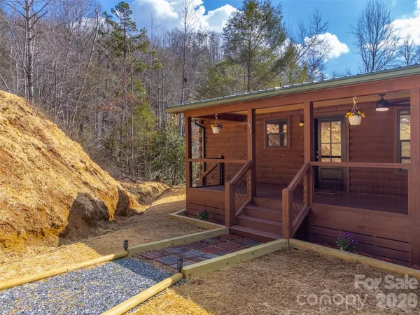 a view of backyard with deck and wooden floor