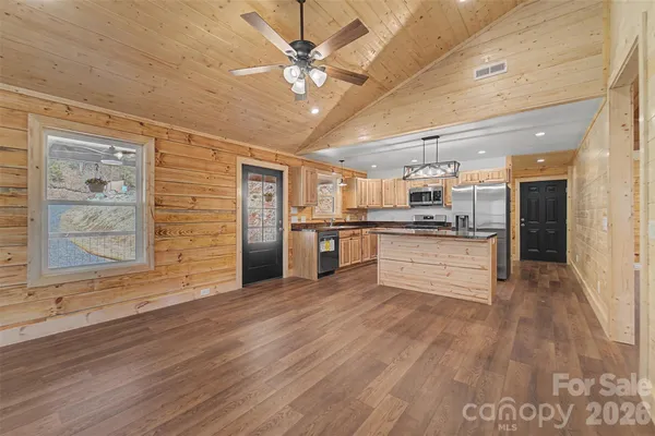 a view of kitchen with cabinets and stainless steel appliances