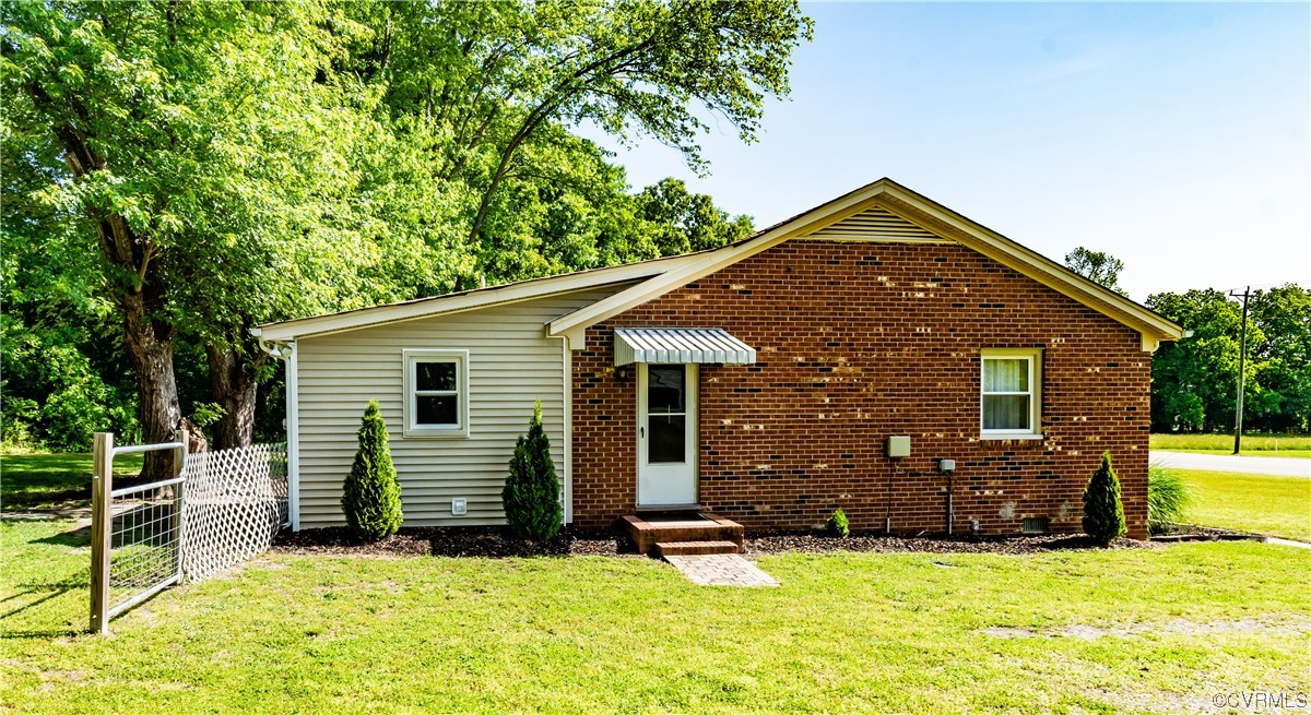 5800 Newbys Bridge Road Chesterfield, VA 23832 - Photo 27 of 29 a front view of house with yard and trees in the background