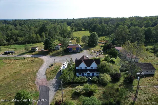 an aerial view of a house with outdoor space