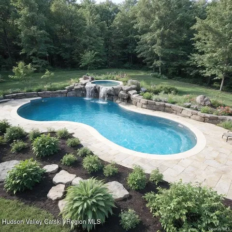 a view of a backyard with sitting area
