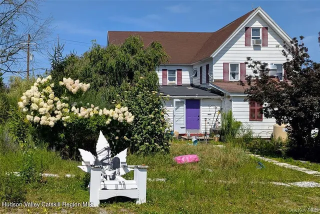 a view of a house with a swimming pool