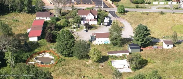 a bedroom with two beds and a large window