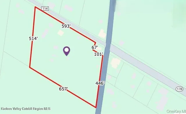 a bedroom with a bed and a night stand next to it