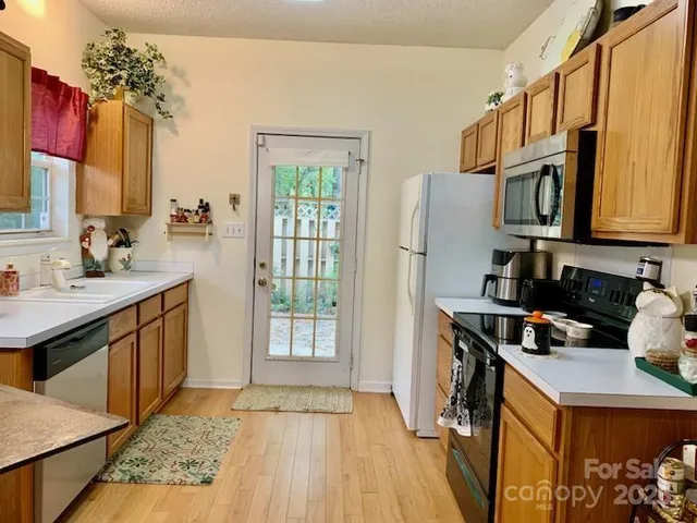a bedroom with furniture a rug and a window