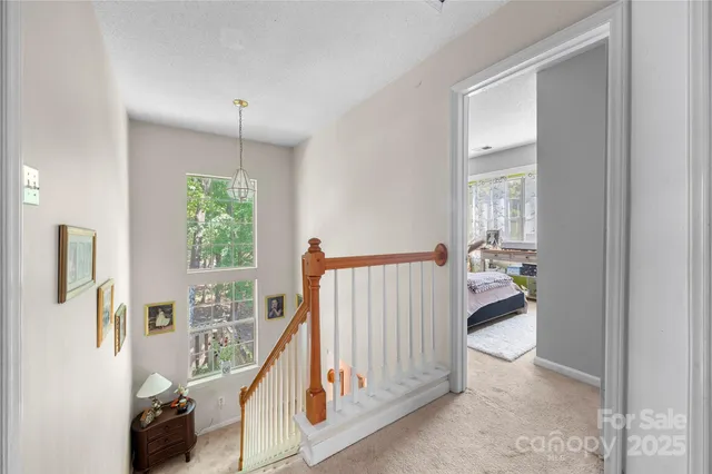 a bedroom with a bed a table and a window