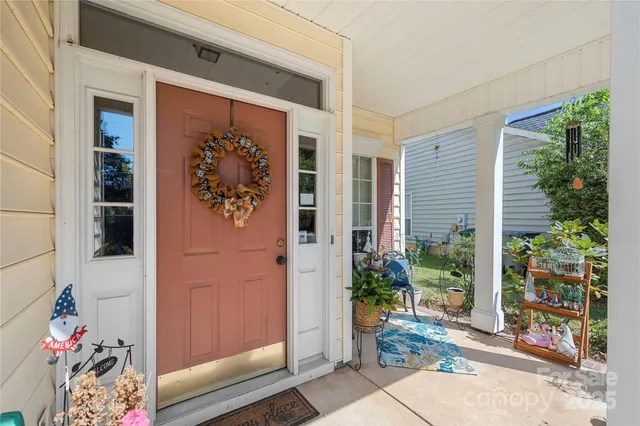 a front door view with a potted plant