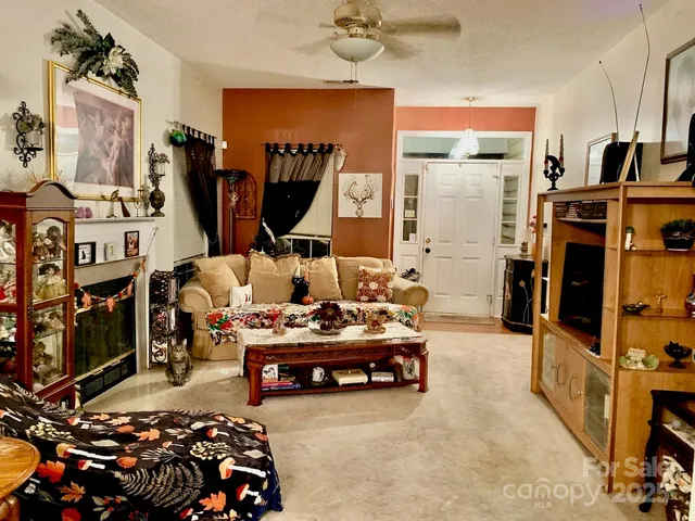 a bed room with furniture and a flat screen tv