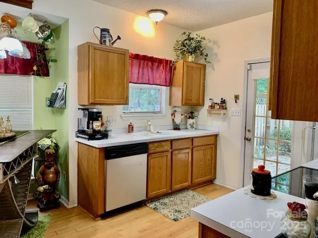 a white refrigerator freezer and a stove sitting inside of a kitchen